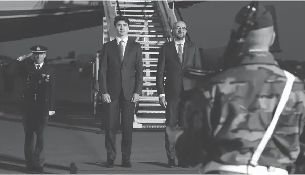  ?? SEAN KILPATRICK / THE CANADIAN PRESS ?? Prime Minister Justin Trudeau stands with Belgian Prime Minister Charles Michel as he arrives in Brussels on Wednesday to attend a NATO summit.