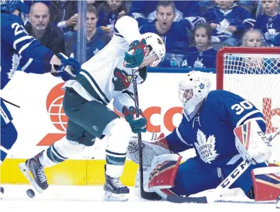  ?? FRANK GUNN THE CANADIAN PRESS ?? Leafs goaltender Michael Hutchinson shuts the door on Minnesota’s Zach Parise during Thursday’s matinee at Scotiabank Arena.