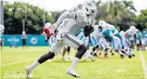  ?? PETER MCMAHON/MIAMI DOLPHINS ?? Wide receiver DeVante Parker runs a pattern during training camp at the Dolphins’ training facility in Davie on Monday.