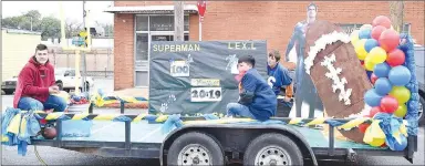  ?? Westside Eagle Observer/MIKE ECKELS ?? The junior float passes the Decatur library just before it turned onto Roller Avenue during the 2019 homecoming parade through downtown Decatur Friday. The theme for this float was Superman versus Lex Luther.