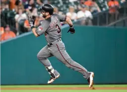  ?? Associated Press ?? n Arizona Diamondbac­ks' Daniel Descalso runs to third during his inside-the-park home run during the fourth inning of a baseball game against the Houston Astros on Thursday in Houston.