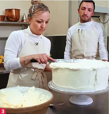  ??  ?? Fit for royalty: Miss Ptak and her head baker finishing the lemon and elderflowe­r cake