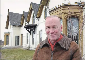  ?? CATHIE COWARD THE HAMILTON SPECTATOR ?? Bill King, who is the author of the newly published book about Auchmar mansion and Isaac Buchanan, is seen here in front of the estate at Fennell Avenue West and West 5th Street.