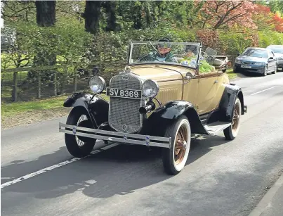  ?? Picture: Dougie Nicolson. ?? One of the cars heads off on Drive it Day yesterday.