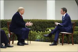  ?? EVAN VUCCI — THE ASSOCIATED PRESS ?? President Donald Trump speaks with Fox News Channel Anchor Bill Hemmer during a Fox News Channel virtual town hall at the White House in Washington on Tuesday.