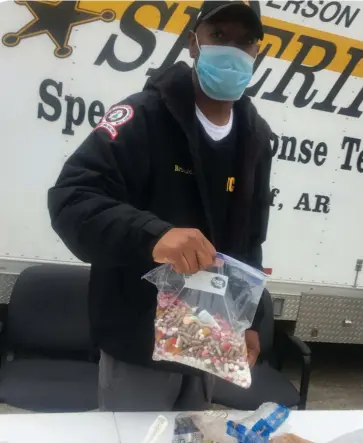  ?? (Special to The Commercial/Deborah Horn) ?? Capt. Yohance Brunson with the Jefferson County sheriff’s office works Saturday during Arkansas’ 19th annual Drug Take Back Day.