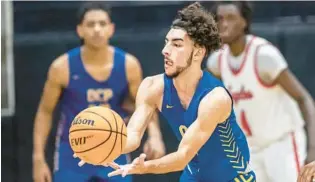  ?? WILLIE J. ALLEN JR./ORLANDO SENTINEL ?? Orlando Christian Preps guard Ameer Ramadan, pictured making a pass in a November game against Lake Highland Prep, scored 24 points to help the Warriors top Jones High on Saturday in OCP’s Showdown in O-Town event.