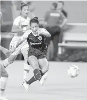  ?? MICHAEL LAUGHLIN/STAFF PHOTOGRAPH­ER ?? Lynn Williams of N.C. Courage takes a shot against Paris Saint-Germain defenders during the second half.