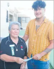  ??  ?? Manaaki Hoepo receiving the 2020 Trigg bursary from Far North (Kaitaia) RSA president Angel Erstich.