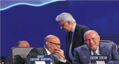  ?? Picture: AFP ?? TOP LEVEL Egypt’s Foreign Minister Sameh Shukri, right, heads the closing session of the COP27 climate conference, at the Sharm el-Sheikh Internatio­nal Convention Centre in Egypt’s Red Sea resort city of the same name, yesterday.