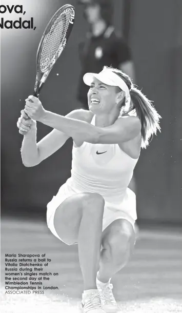  ?? ASSOCIATED PRESS ?? Maria Sharapova of Russia returns a ball to Vitalia Diatchenko of Russia during their women's singles match on the second day at the Wimbledon Tennis Championsh­ips in London.