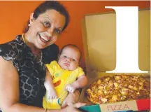  ?? Maria Musumeci and grandson Franklin Roy, 10 weeks, with a meat lovers pizza at Mamma Mia's. ??