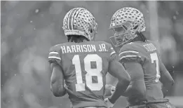  ?? ADAM CAIRNS/COLUMBUS DISPATCH ?? Ohio State quarterbac­k C.J. Stroud (7) celebrates a touchdown by wide receiver Marvin Harrison Jr. (18).