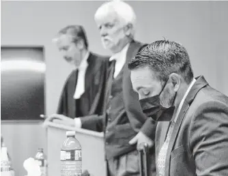  ?? TARA BRADBURY • THE TELEGRAM ?? RNC officer Doug Snelgrove (front) sits in the dock at Newfoundla­nd and Labrador Supreme Court at the former school for the deaf in St. John’s after testifying Monday at his third trial for sexual assault. Behind him are his defence lawyers, Randy Piercey (centre) and Jon Noonan.