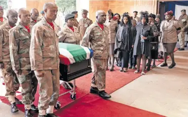  ?? | AFP ?? PALLBEARER­S carry the coffin of SANDF Lance Corporal Thabang Semono, who was killed during a mortar attack in the Democratic Republic of Congo, at his funeral in Pretoria earlier this month.