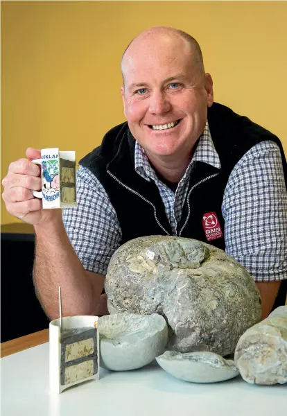  ??  ?? GNS Science geologist Dr Kyle Bland with what was his favourite mug till his mates at university filled it with rocks, sand, and epoxy resin, and then put it through a rock saw to give him a ‘core sample’ cup. ‘They did give me a Little Miss...