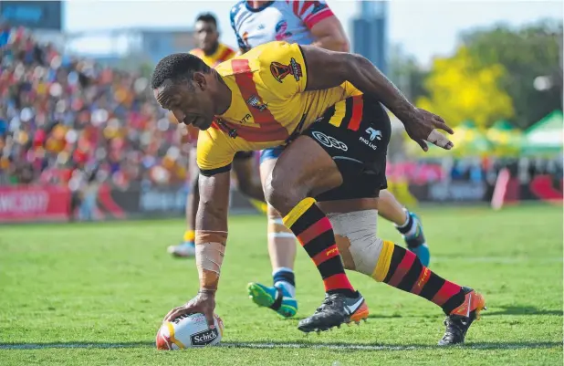  ?? Picture: AAP IMAGE ?? RAY OF HOPE: Rod Griffin of Papua New Guinea scores a try during the Pool C World Cup match against the USA in Port Moresby on Sunday.
