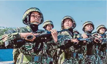  ?? FILE PIC ?? Women soldiers at a passing-out parade after completing training at the Army Basic Training Centre in Port Dickson in 2019. Many female service members are reluctant to divulge their health issues to superiors or colleagues.