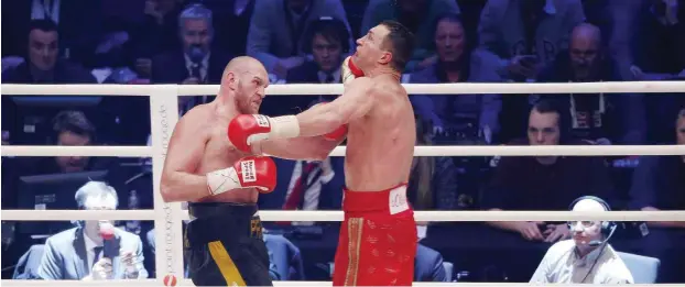  ?? Foto: imago/Norbert Schmidt ?? Wladimir Klitschko (r.) bereitet sich lieber auf die WM-Revanche Ende Oktober gegen Tyson Fury vor als bei den Olympische­n Sommerspie­len in Rio zu kämpfen.