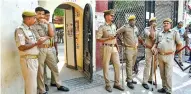  ?? ?? Police stand guard ourside the court during the hearing of Gyanvapi Masjid-Shringar Gauri Temple case, on Tuesday