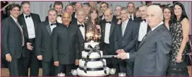  ?? DK PHOTO ?? Let them eat cake: Honorary chair Benito Migliorati cuts the cake while co-presidents look on at the LGH Foundation’s ball.