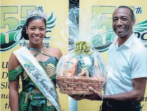  ??  ?? Miss Jamaica Festival Queen 2018, Miss St Mary, Ackera Gowie (left) ,with Dwight Jackson, commercial operations manager, JP Tropical Foods Limited.