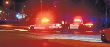  ?? ADOLPHE PIERRE-LOUIS/JOURNAL ?? APD officers block traffic on Broadway SE just south of Gibson following a report of an active shooter at a nearby warehouse on Monday.