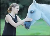  ?? Vertical Entertainm­ent ?? THE APTLY NAMED Faith (Brighton Sharbino) finds horses have more to offer her than city life does.