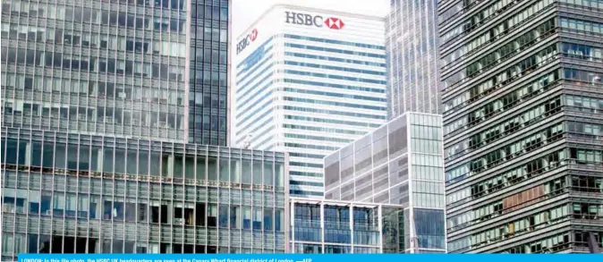  ??  ?? LONDON: In this file photo, the HSBC UK headquarte­rs are seen at the Canary Wharf financial district of London.