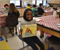  ?? LAURA CATALANO — FOR MEDIANEWS GROUP ?? East Vincent Elementary School fourth-grader Armani White displays her “mirror book,” which reflects her own experience­s.