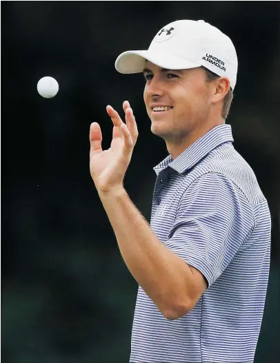  ?? — GETTY IMAGES ?? Jordan Spieth reaches for his golf ball on the 18th green during the final round of the Hero World Challenge at the Isleworth Golf & Country Club on Sunday in Windermere, Fla.