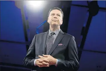  ?? Justin Tang Canadian Press ?? GOP SUPPORT for the FBI has dropped since Director James B. Comey was fired by President Trump, who accuses the agency of helping conduct a “witch hunt” into possible ties to Russia’s interferen­ce in 2016 election.