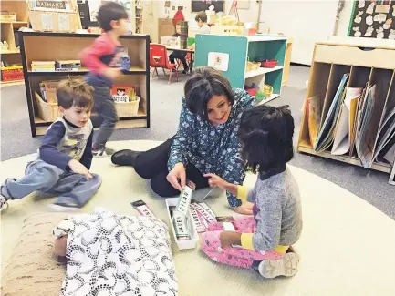  ?? ROBERT NOTT/THE NEW MEXICAN ?? Patricia Azuara, Santa Fe Public Schools’ early childhood leader liaison, reviews the spelling of student names with youngsters in an E.J. Martinez Elementary School classroom. The state Public Education Department has awarded three programs in the district a toplevel five-star rating.