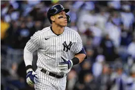  ?? FRANK FRANKLIN II / ASSOCIATED PRESS ?? New York Yankees’ Aaron Judge watches his solo home run ball during the second inning of Game 5 of the American League Division series against the Cleveland Guardians on Oct. 18. Judge has agreed to return to the Yankees on a $360 million, nine-year contract, according to a person familiar with the deal.