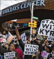  ?? JOHN MINCHILLO/ASSOCIATED PRESS 2021 ?? Protesters rally against COVID-19 vaccinatio­n mandates and in support of basketball player Kyrie Irving outside the Barclays Center before a Brooklyn Nets game Oct. 24 in New York.