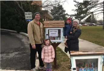  ?? Photos : Erin Mecklenbur­g ?? The Mecklenbur­g family stands by the Little Free Food Pantry located by the Payson City offices.