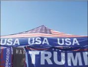  ?? Jacqueline Larma / Associated Press ?? A Trump merchandis­e tent is in a parking lot in Moosic, Pa., before the arrival of President Donald Trump on Aug. 20 in nearby Old Forge, Pa.