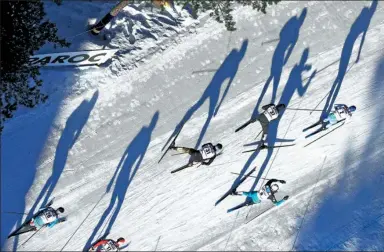  ?? MATTHIAS SCHRADER / ASSOCIATED PRESS ?? Athletes cast shadows as they compete in the men’s 50-kilometer race during the 2017 Nordic Skiing World Championsh­ips in Lahti, Finland, on Sunday.