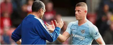  ?? — Reuters ?? Great job: Chelsea manager Maurizio Sarri (left) shaking hands with Ross Barkley during the Premier League match against Southampto­n at St Mary’s on Sunday.