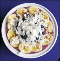  ?? PHOTO BY EMILY RYAN ?? Enjoy this fruit-filled acai bowl at Raw Can Roll Café in Wayne.