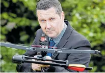  ??  ?? Expressman Paul Jeeves with a crossbow he bought