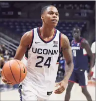  ?? Jessica Hill / Associated Press ?? UConn freshman Jordan Hawkins’ jersey matches the Huskies’ ranking in the preseason poll — No. 24.