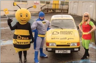  ??  ?? Batman David Glen with Robin (wife Helen Glen) and Beatson mascot Bella