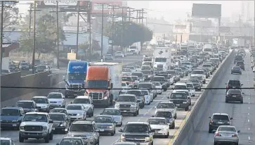  ?? Allen J. Schaben Los Angeles Times ?? CALIFORNIA LAW requires truck drivers to take a 30-minute break in their first five hours on shift, and another break after five more hours. Federal regulation­s are less strict. Above, the 5 Freeway in Los Angeles.