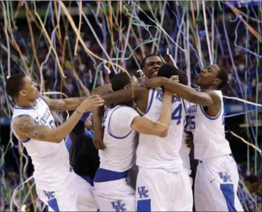  ?? THE ASSOCIATED PRESS FILE ?? Kentucky players celebrate at the end of the 2012 championsh­ip game against Kansas, in New Orleans.