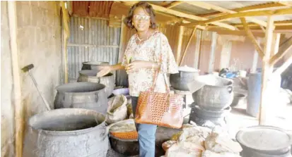  ?? PHOTO: NAN ?? Coordinato­r of NAFDAC, South West Zone, Mrs Rosaline Ajayi showing round the unhygienic pots used at the alleged unregister­ed At-Taqwah Multipurpo­se Herbal Medicine factory that was sealed by NAFDAC officials in Ibadan on Friday