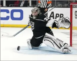  ?? PHOTOS BY MARK J. TERRILL — THE ASSOCIATED PRESS ?? Kings goaltender Jonathan Quick reaches out s the puck comes his way during Game 4 against the Oilers. Quick made 31saves to record the 10th playoff shutout of his career.