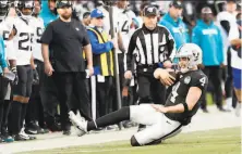  ?? Scott Strazzante / The Chronicle ?? The Raiders’ Derek Carr slides after running for a first down in the fourth quarter of the team’s 2016 loss to the Jaguars.