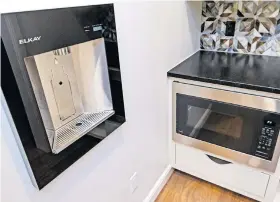  ??  ?? Water bottle filling machine in the pantry at 2229 Stone Mill Court, by John Nail Homes.