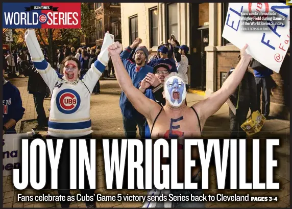  ?? ASHLEE REZIN/ SUN- TIMES ?? Fans celebrate outside Wrigley Field duringGame­5 of theWorld Series Sunday.